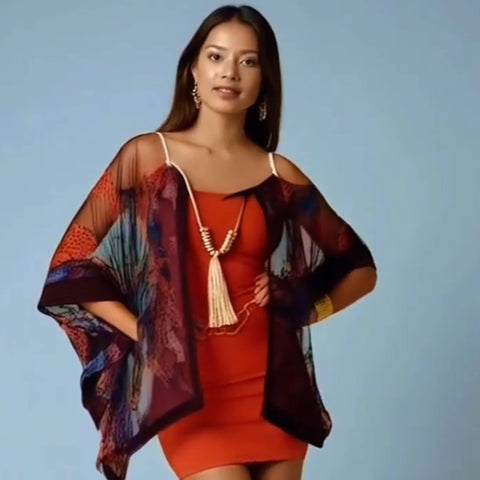 Handmade boho necklace with silver beads, tassel fringe, and beige natural stones