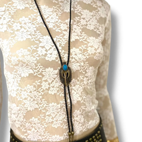 Antique Bird Turquoise Western Bolo Tie with brass eagle pendant, faux turquoise stone and black cord worn low