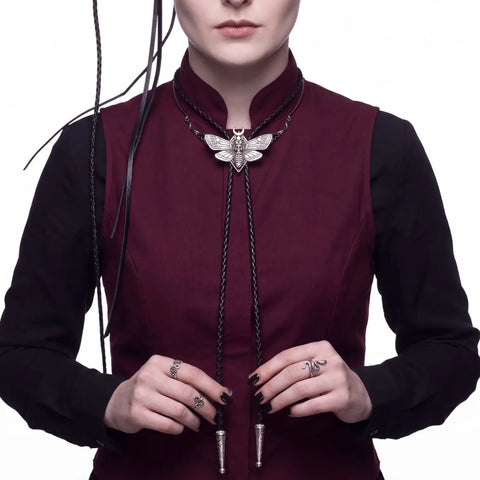 Antique Silver Winged Skull Bolo Tie with moth pendant and braided leather cord unisex style