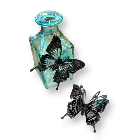 Oversized black butterfly dangling earrings with 3D layered wings in black and clear plastic – statement fairycore and Halloween jewelry