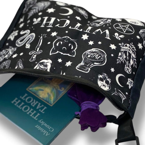 Witchy black canvas satchel with celestial and gothic illustrations in white with tarot book and crystal gem bag