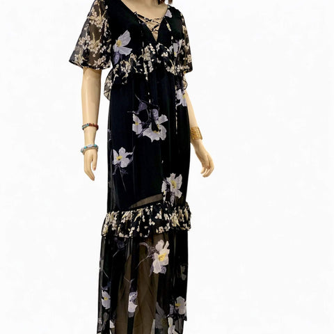 Black v-neck floral summer maxi dress with lace-up neckline, empire waist, and ruffle trim hem by Flying Tomato – boho chic fashion angle front