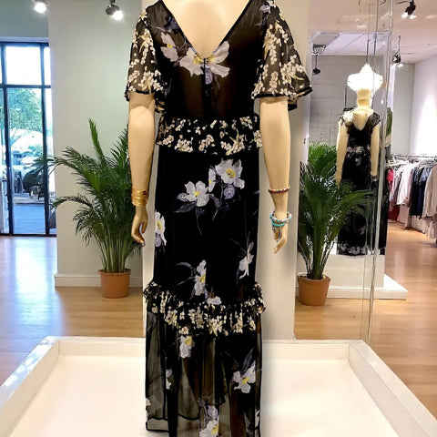 Black v-neck floral summer maxi dress with lace-up neckline, empire waist, and ruffle trim hem by Flying Tomato – boho chic fashion