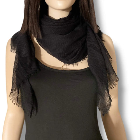Black oversized cotton scarf cloak styled as a neck wrap, shoulder shawl and hooded layering piece