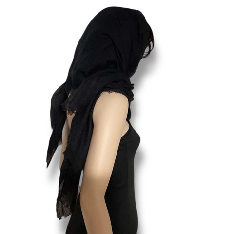 Black oversized cotton scarf cloak styled as a neck wrap, shoulder shawl and hooded layering piece