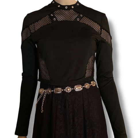 Black cut out mesh studs cropped top with fishnet panel sleeves, silver grommet neckline straps, and keyhole back button closure, women’s fitted size large