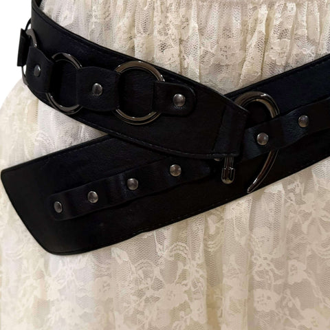 Black Studded O-Rings Wide Belt with gunmetal hardware styled as a waist cincher