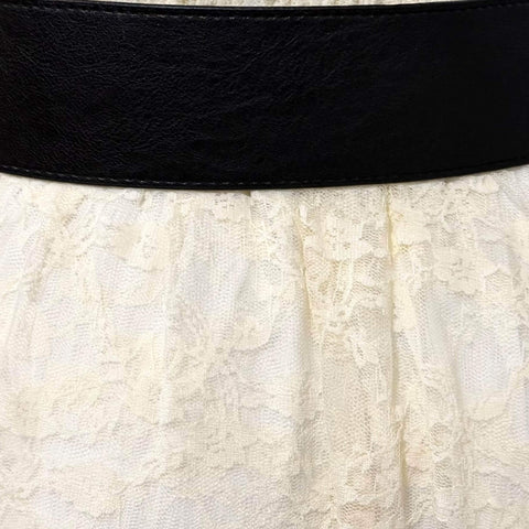 Black Studded O-Rings Wide Belt with gunmetal hardware styled as a waist cincher