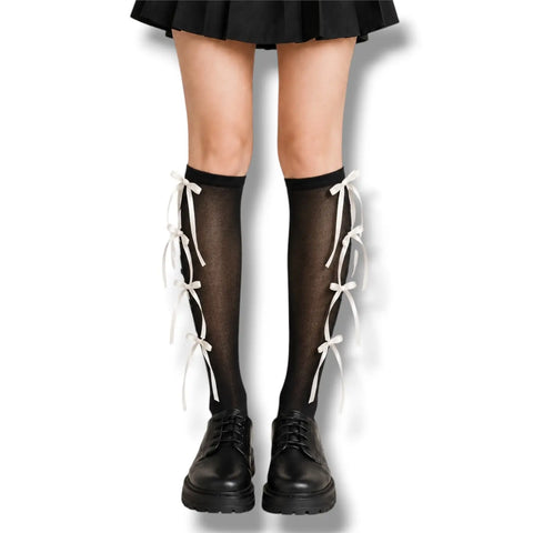 Knee High Socks with Long Bow Ribbons featuring ribbed knit texture and oversized satin bow details