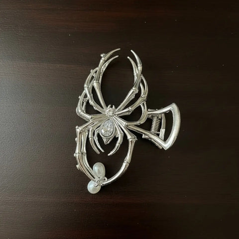 Silver spider hair claw clip with rhinestone body, elongated legs and dangling faux pearl accents