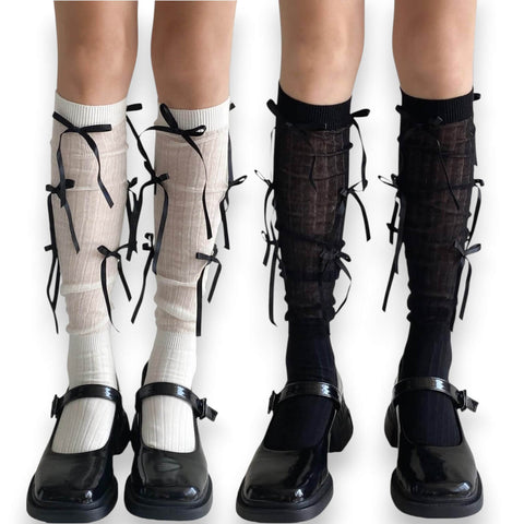 Woman wearing knee high socks with long satin bow ribbons, coquette balletcore legwear for cosplay, Y2K fashion, and festival outfits.
