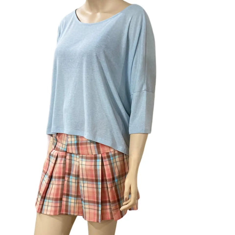 Blue wide boxy top with scoop neckline, dolman sleeves and adjustable lace-up side panels