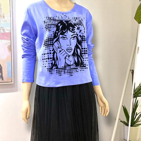 model wearing plus size blue delia’s style long sleeve graphic tee
