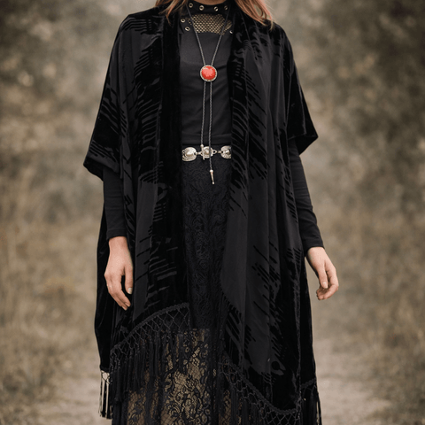 Black long fringe velvet duster jacket with wavy burnout texture, open-front kimono style, relaxed sleeves, and tassel hem for boho western festival layering