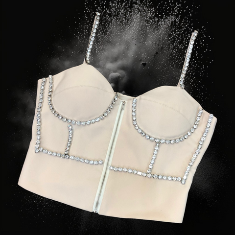 Cream cropped corset top with silver prong-set crystal embellishments and front zip closure