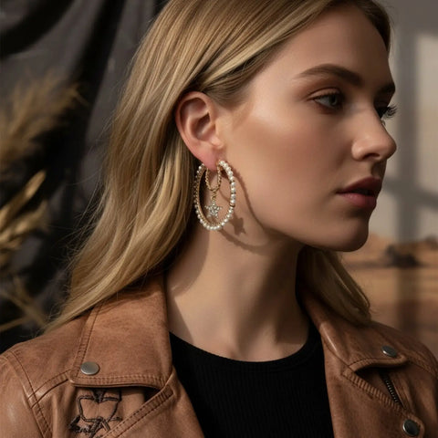 Gold multi-ring hoop earrings with faux pearls, rhinestone stars and layered celestial crystal details