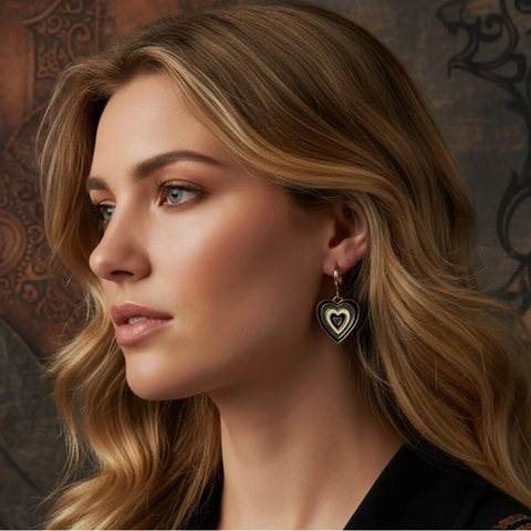 Black and white enamel heart charm earrings with small gold-tone huggie hoops