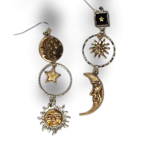 Cosmic sun moon star dangle earrings in silver and gold. Asymmetrical celestial charms with boho Y2K, witchy, gothic fashion influence. Lightweight drop earrings.