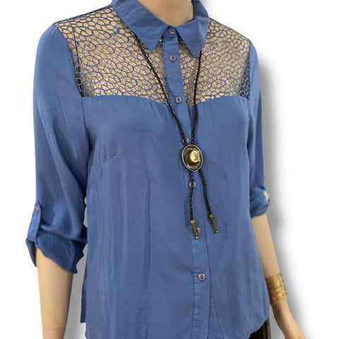 Western brass cowboy hat bolo tie with antique brass hat pendant, black braided leather rope, and silver-tipped ends styled for boho and western fashion.