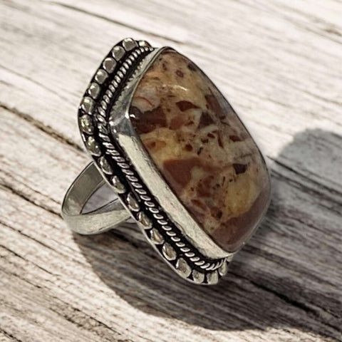 Side view of Crazy Horse Jasper ring showing intricate sterling silver lace border and earthy gemstone patterns