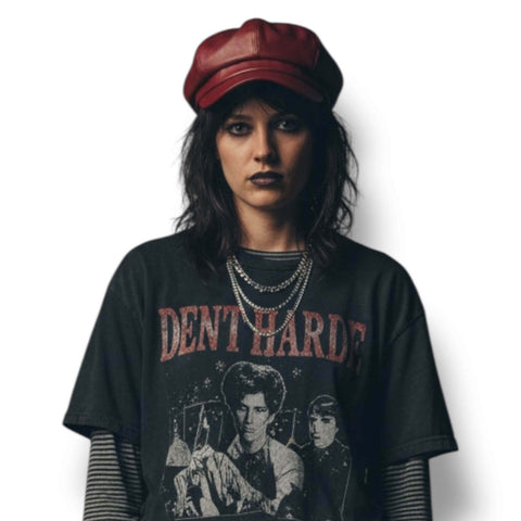 Faux Leather Retro Newsboy Cap Model in Grunge Streetwear style wearing a Dark Red newsboy hat, layered silver chains and graphic tee.