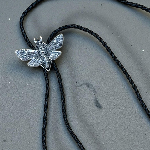 Antique Silver Skull Moth Bolo Tie with moon accents and braided leather cord western goth neckwear