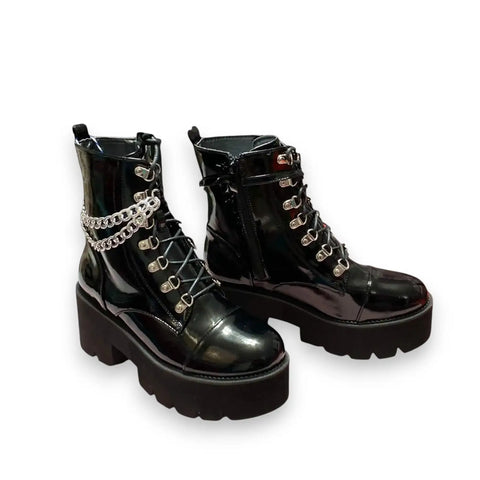 Black patent platform combat boots with silver D-rings, removable ankle chain and chunky lug sole