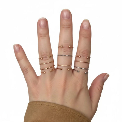 Fidget beaded ring set with 8 adjustable mixed-metal open bands and movable bead details backside
