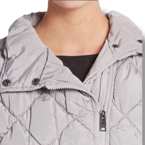 woman wearing open neckline zip up gray quilted puffer vest