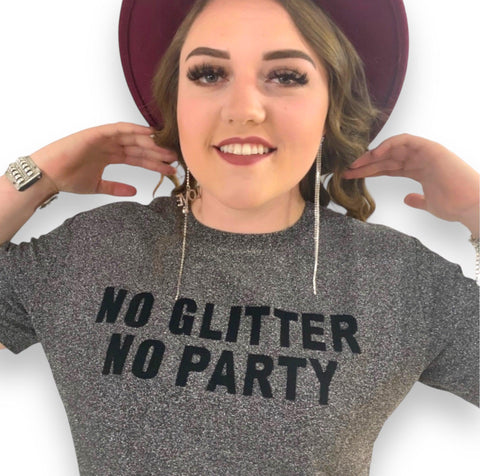 Front view on model: gray short sleeve metallic graphic tee with "NO GLITTER NO PARTY" in black lettering on chest
