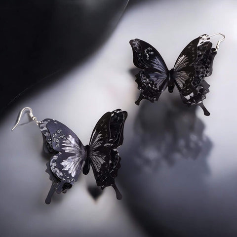 Oversized black butterfly dangling earrings with 3D layered wings in black and clear plastic – statement fairycore and Halloween jewelry