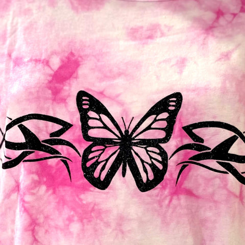 tattoo-inspired butterfly graphic close-up on tie dye shirt