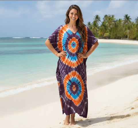 woman wearing a tribal purple and orange kaftan dress beach cover up front view