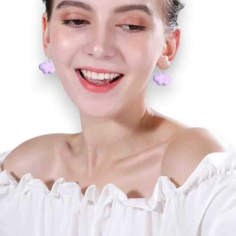 white cartoon cloud drop earrings on model 