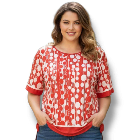 woman wearing the Plus Retro Abstract Red & White Dot Blouse with jeans