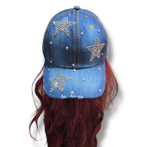 Dark blue denim baseball cap with rhinestone star and silver stud detailing on front and brim, curved stiff brim, adjustable back strap, head size 21 to 24 inches