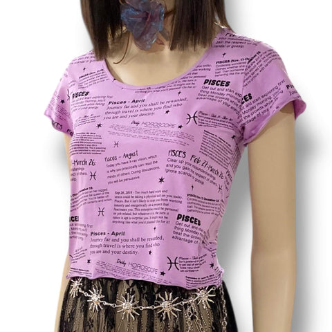 short sleeve graphic pisces baby tee in lilac purple with black zodiac print, fitted crop top with lettuce trim