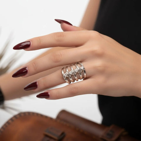 Silver cut out ribcage ring with vertebrae-inspired metalwork, marquise crystals and adjustable band