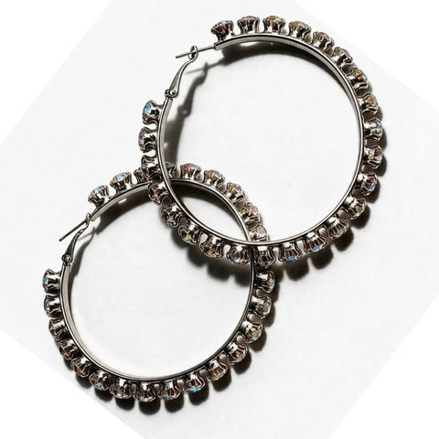 Silver Crystal Large Hoop Earrings with prong-set clip closure Aurora Borealis rhinestones and iridescent sparkle flat lay