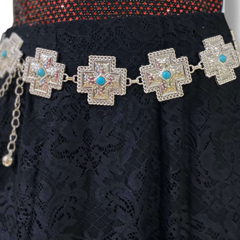 Silver turquoise cross western chain belt with textured cross medallion links and green faux turquoise centers, adjustable clasp closure, worn at waist or hips.