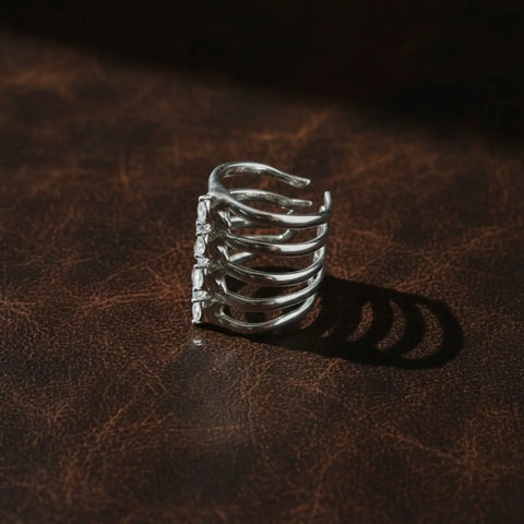 Silver cut out ribcage ring with vertebrae-inspired metalwork, marquise crystals and adjustable band
