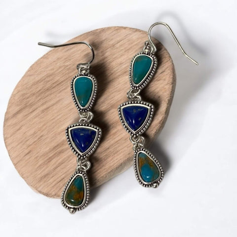 close-up of braided silver setting with faux turquoise stones