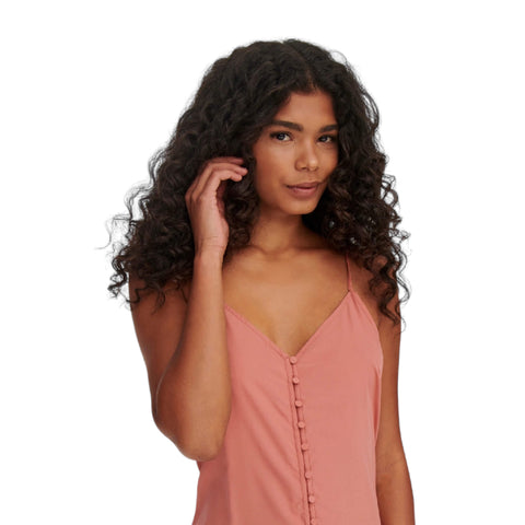 Rose pink sleeveless maxi dress with button-down front, crisscross back, and high-low ruffle hem, styled for boho western summer fashion