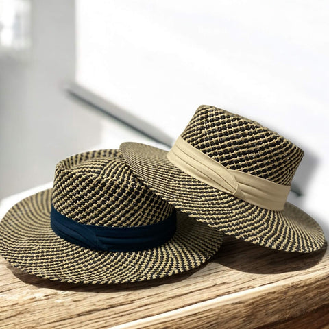Bold summer straw boater hat with pork pie crown and two-tone black ivory styling.
