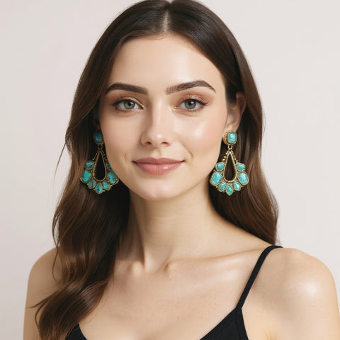 model wearing turquoise teardrop western drop earrings