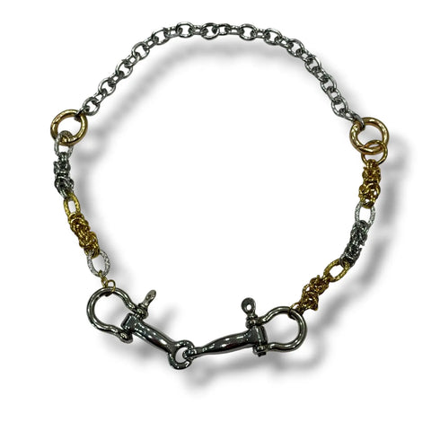 Two tone shackle necklace with silver and gold chains, twin drops and equestrian-inspired metal hardware