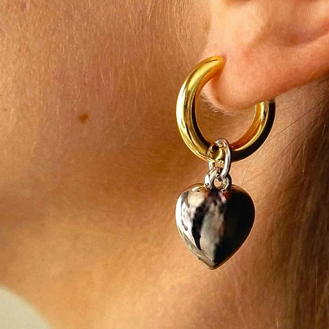 Two Tone Heart Hoop Earrings with gold hoops and silver puffy heart charms