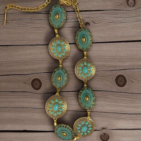Wild West gold turquoise metal concho belt with oval and round patina links and turquoise stones, styled as a boho western waist accessory