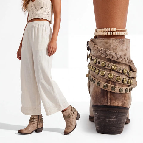 Close-up of the multi-strap ankle detailing, featuring braided tan leather and brass-tone studs.
