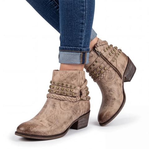 Detail view showing the inner shaft zipper and textured leather construction of the Western Tan Leather Braided Ankle Boots.